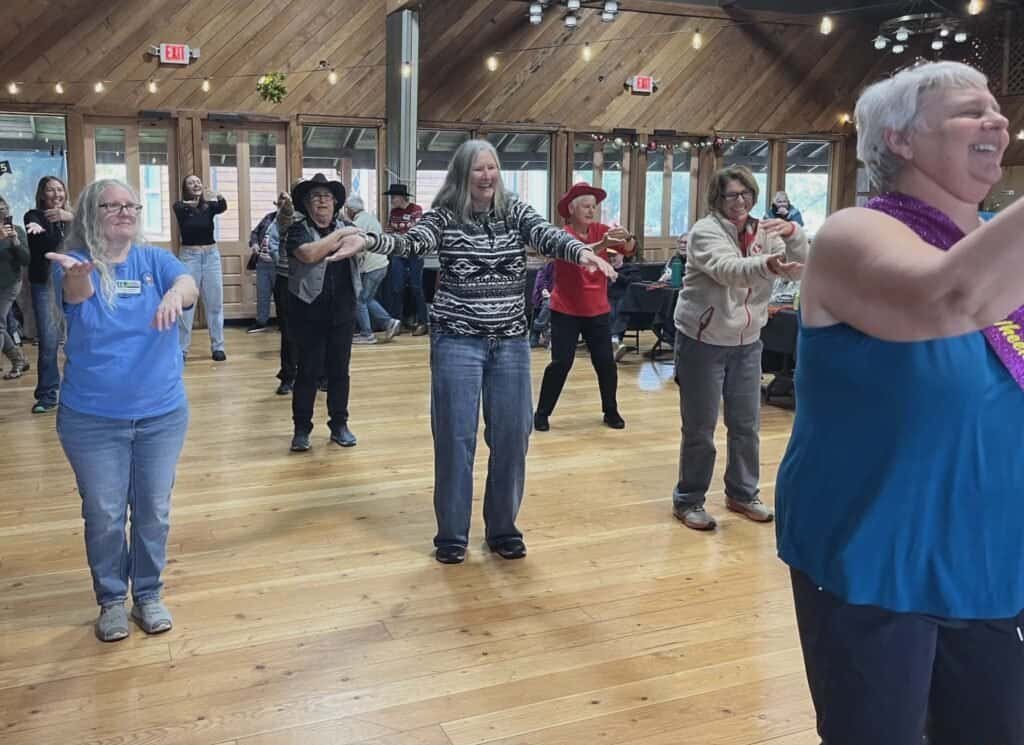 Enjoying RVing, traveling, camping, nature at a women’s RV gathering with dancing and socializing.